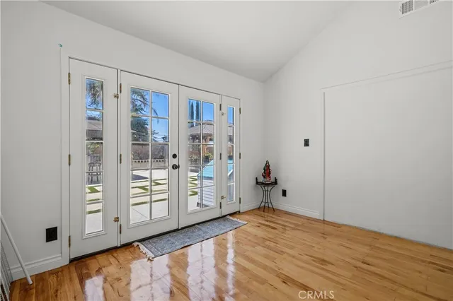 a bathroom with a granite countertop toilet sink a mirror and vanity