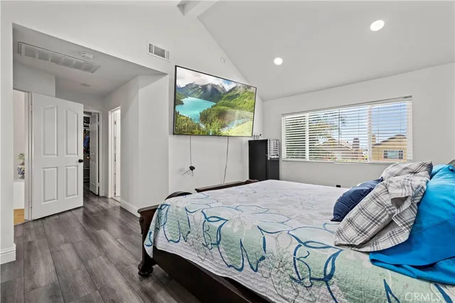 a spacious bathroom with a tub sink and mirror