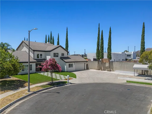 a view of swimming pool in the backyard of house with outdoor seating
