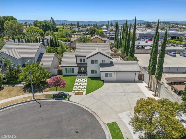 a view of a patio with table and chairs and potted plants