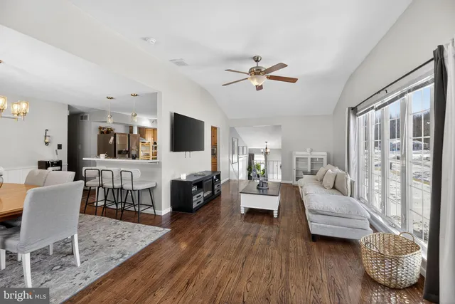 a living room with furniture fireplace and flat screen tv