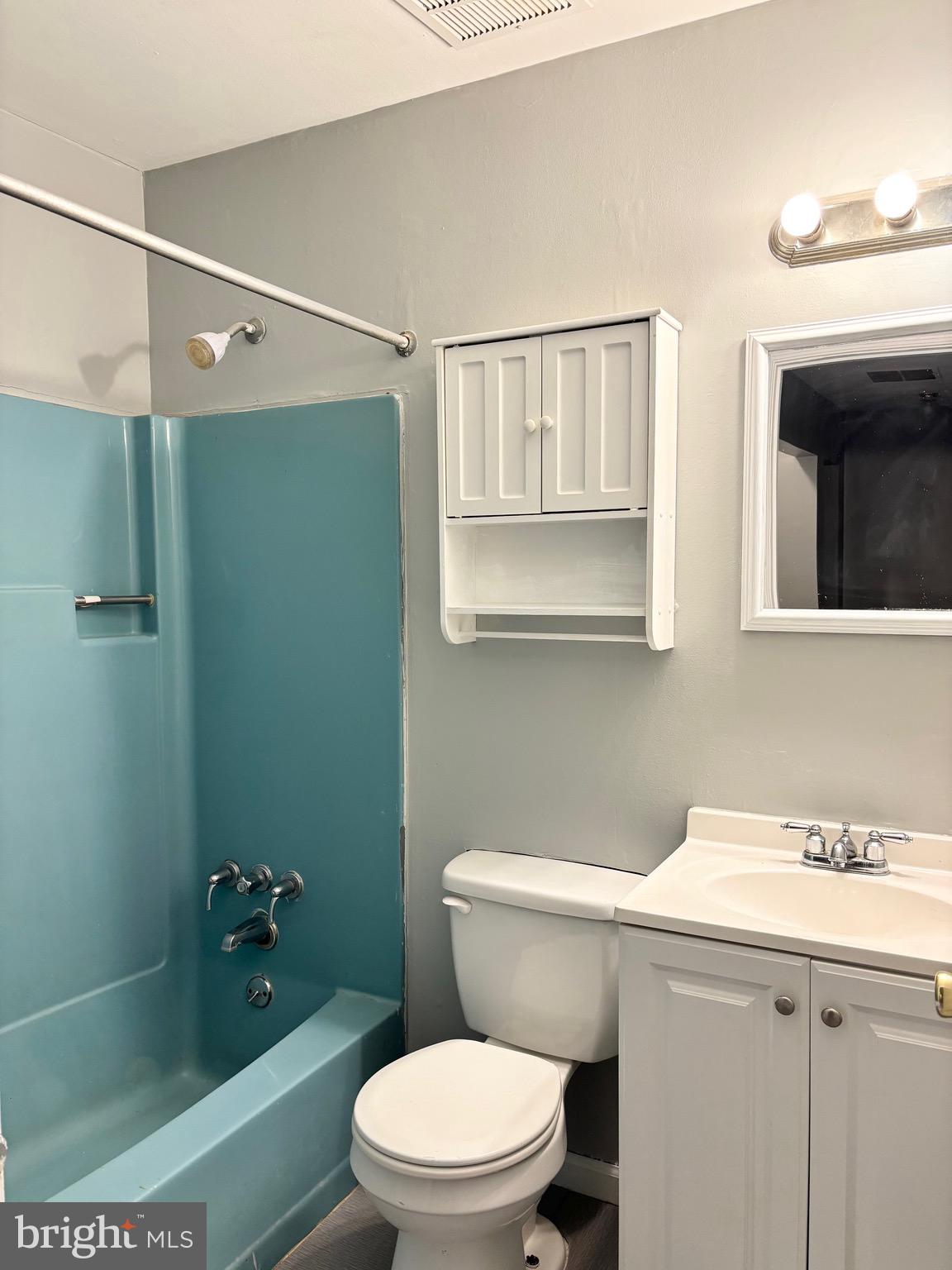 61 Berkshire Road Sicklerville, NJ 08081 - Photo 9 of 14 a white toilet sitting next to a bathroom sink