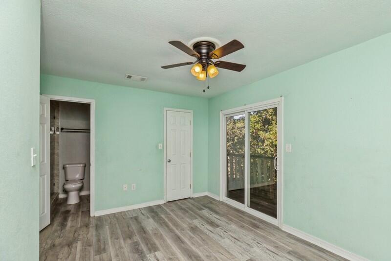 14 Gardner Drive Shalimar, FL 32579 - Photo 13 of 27 a view of empty room with wooden floor and fan