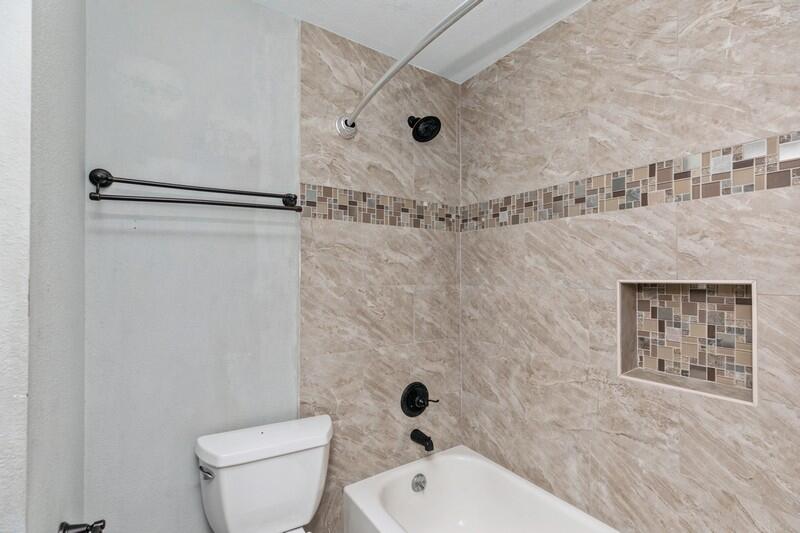 14 Gardner Drive Shalimar, FL 32579 - Photo 18 of 27 a bathroom with a toilet and a shower