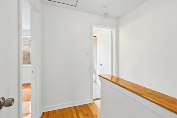 a view of walk in closet with clothes