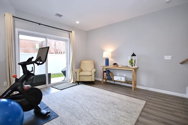 a bedroom with furniture and a mirror