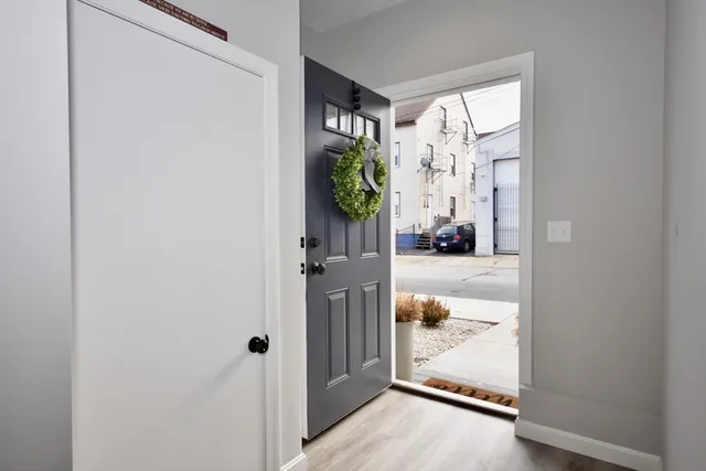 a view of a hallway to rooms