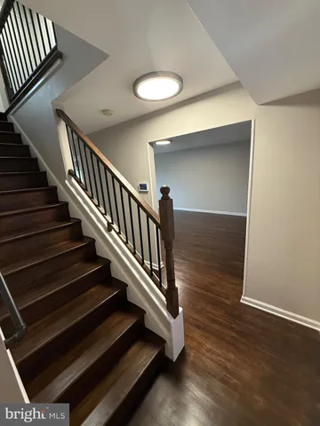 wooden floor with staircase