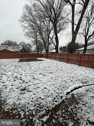a view of yard covered with snow