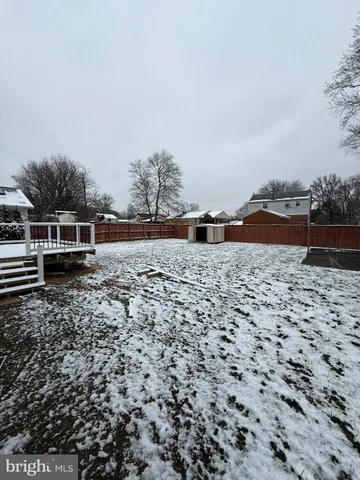 a view of yard with wooden fence