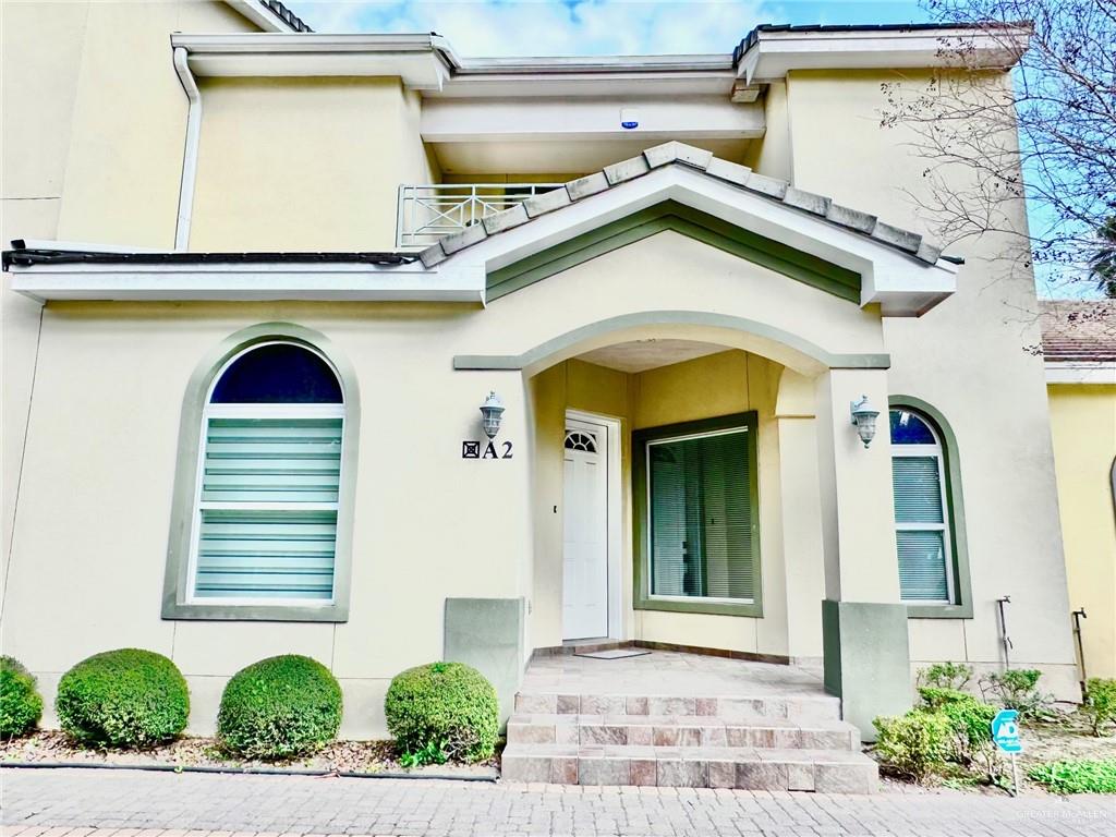 800 Sunset Drive, Unit A2 McAllen, TX 78503 - Photo 1 of 1 a front view of a house with garage
