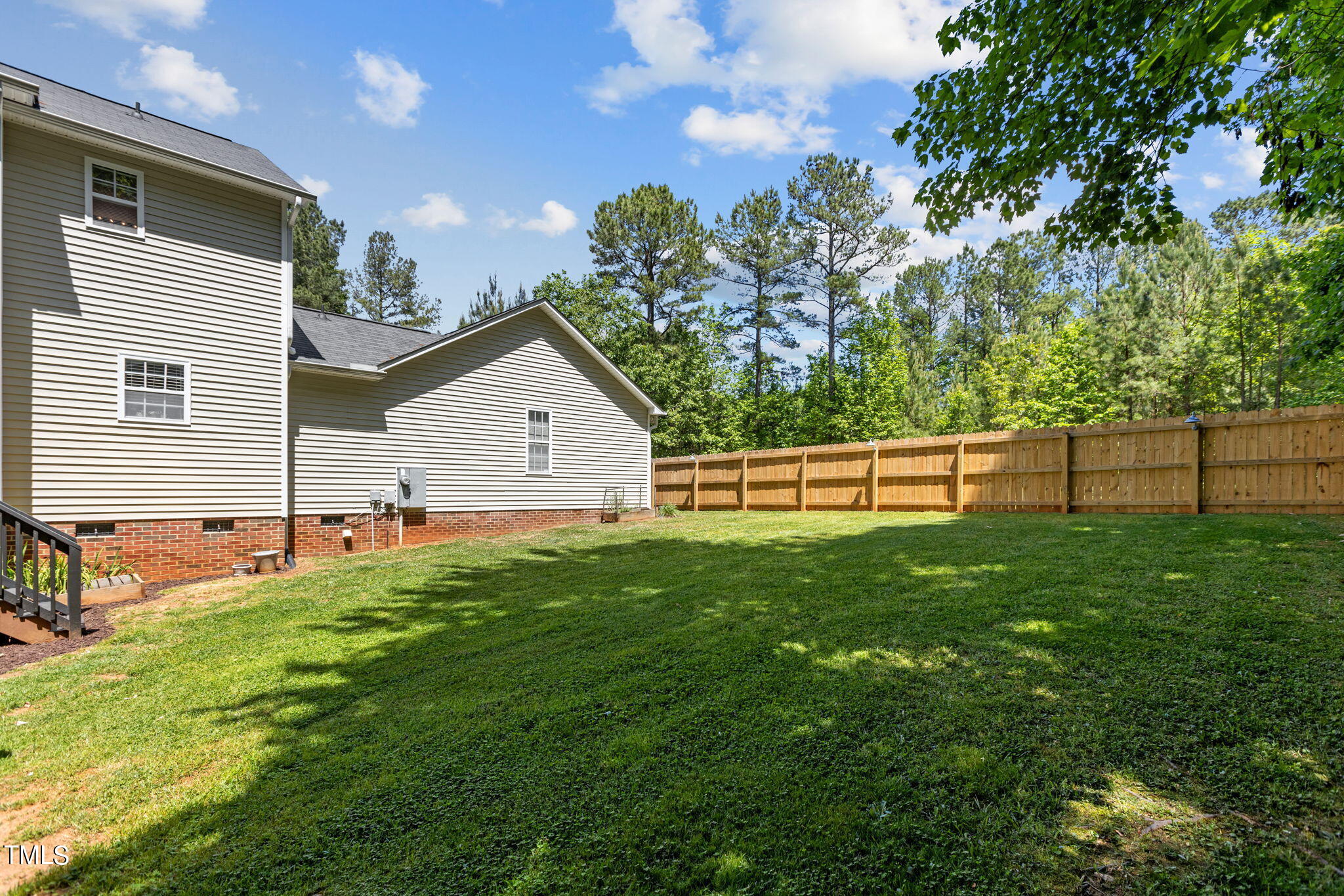 1933 Middle Ridge Drive Willow Spring, NC 27592 - Photo 35 of 45 Middle Ridge back yard to house