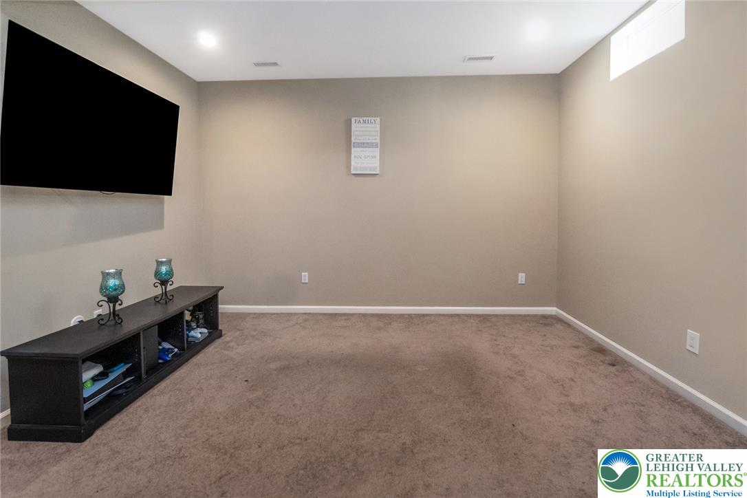 3566 Penfield Way Nazareth, PA 18064 - Photo 5 of 47 Well-lit room offers ample space for comfortable relaxation.