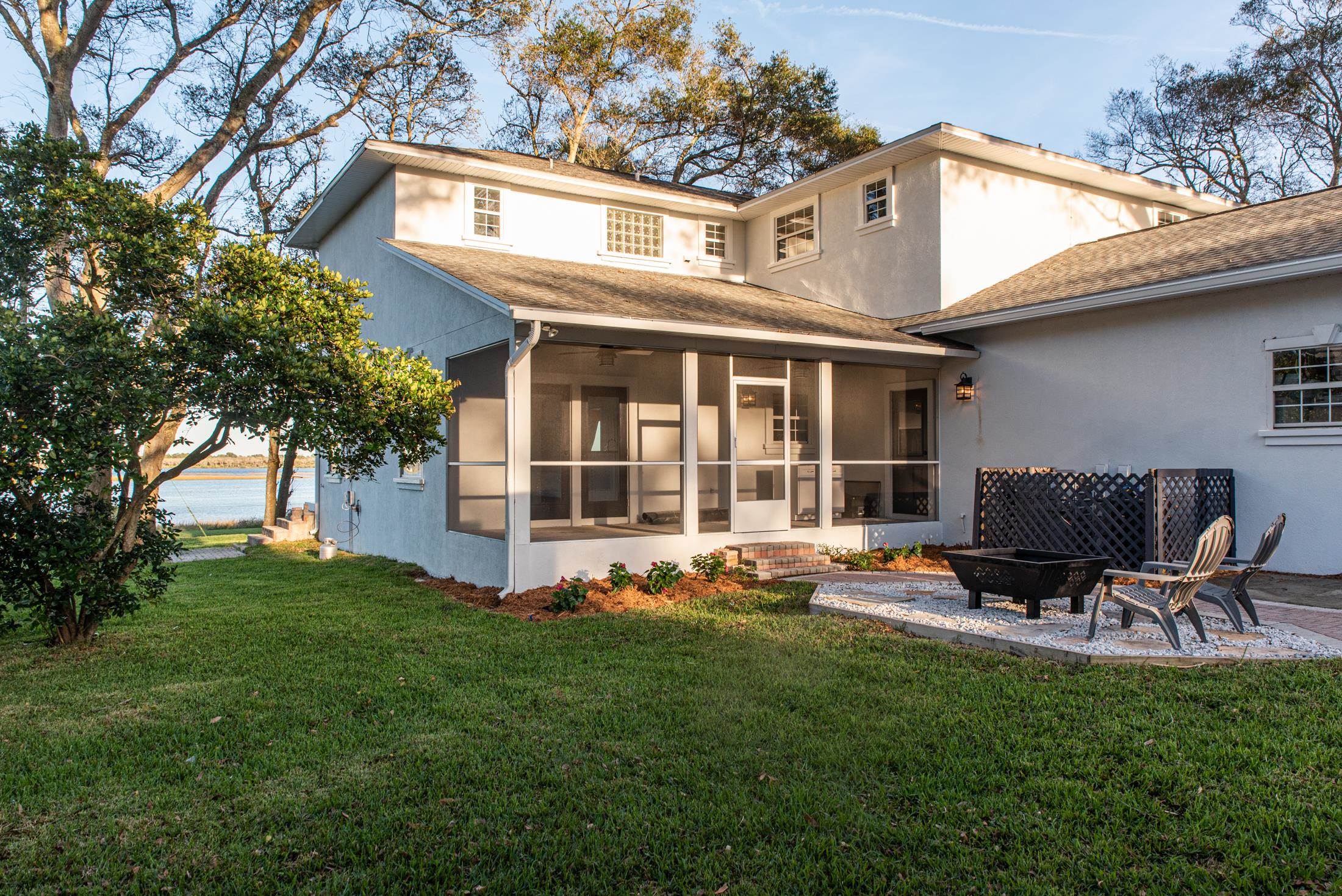141 Jupiter Road St. Augustine, FL 32086 - Photo 40 of 48 a backyard of a house with table and chairs