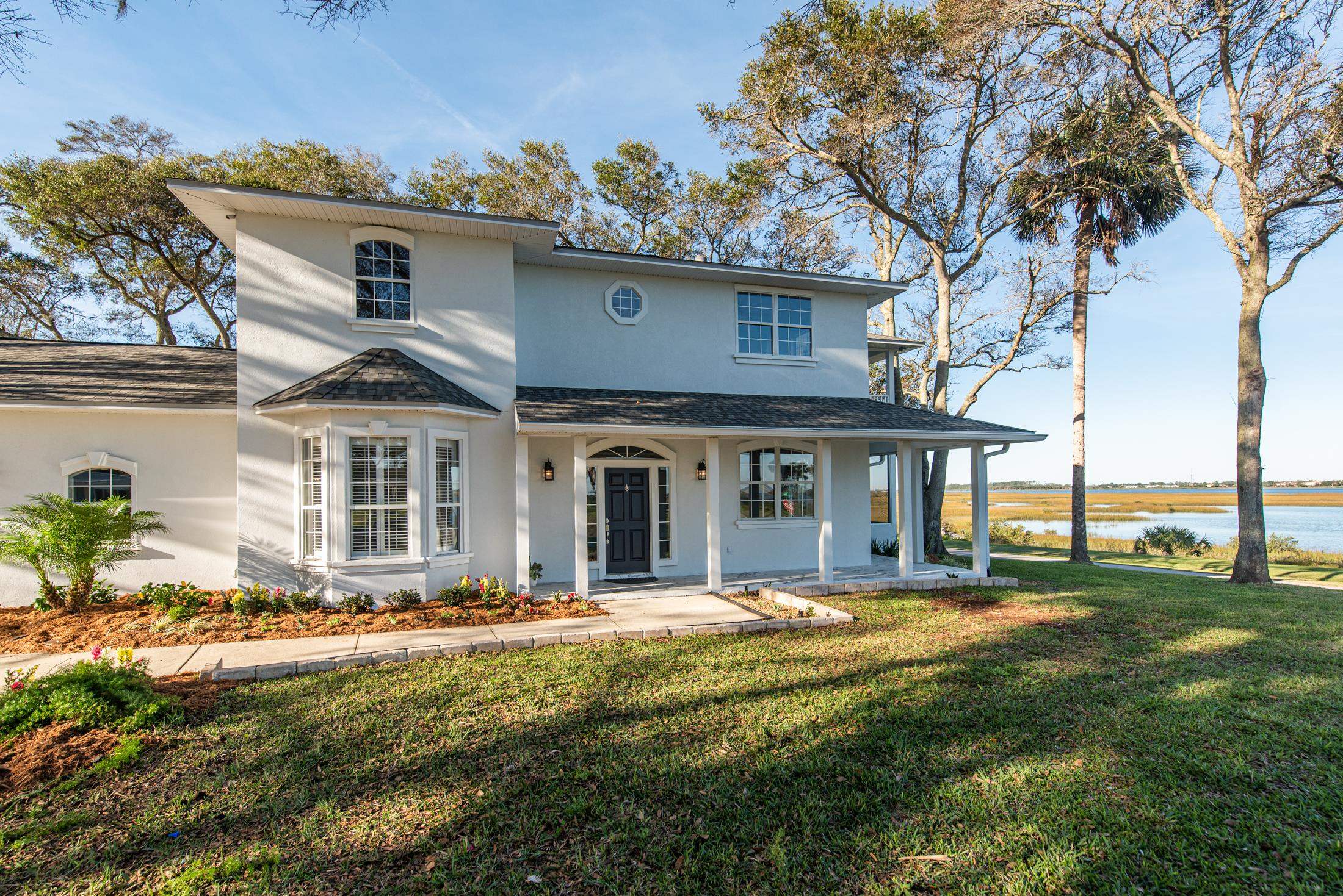 141 Jupiter Road St. Augustine, FL 32086 - Photo 4 of 48 a front view of a house with a yard