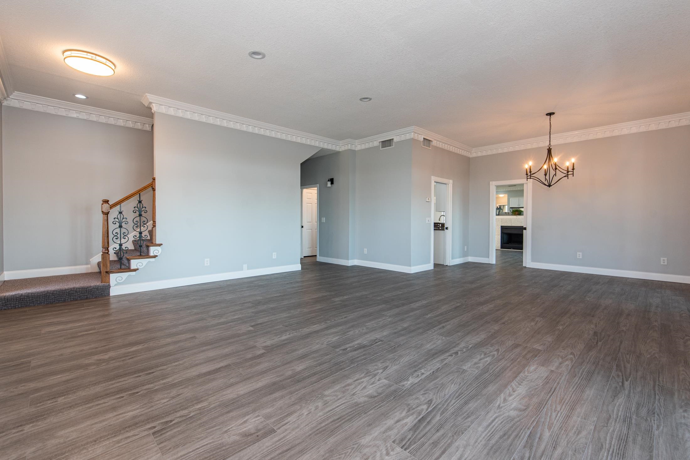 141 Jupiter Road St. Augustine, FL 32086 - Photo 8 of 48 an empty room with wooden floor and windows
