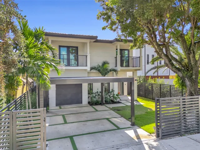 a view of house with a garden and pathway