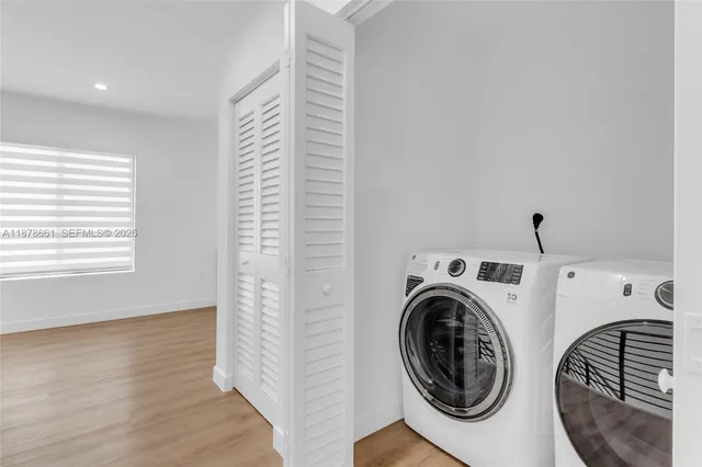 a view of livingroom with washer and dryer