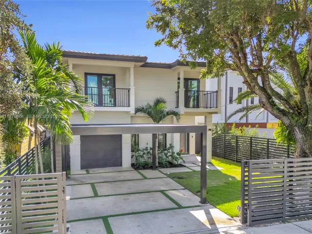 a view of a backyard with swimming pool and furniture