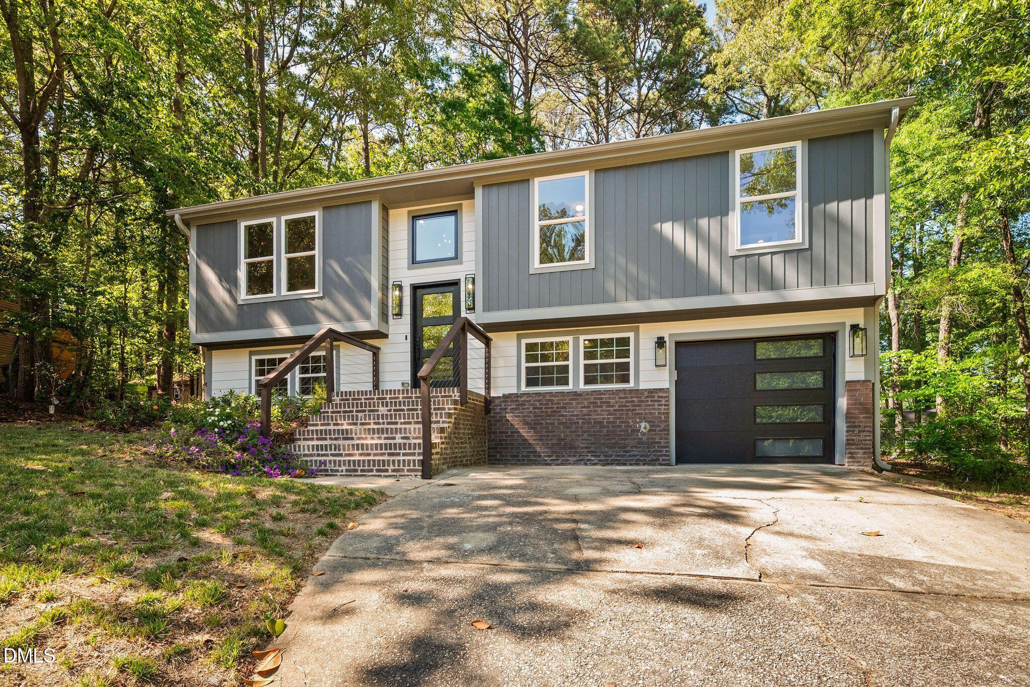 313 Crown Oaks Drive Raleigh, NC 27615 - Photo 60 of 60 a front view of a house with a yard