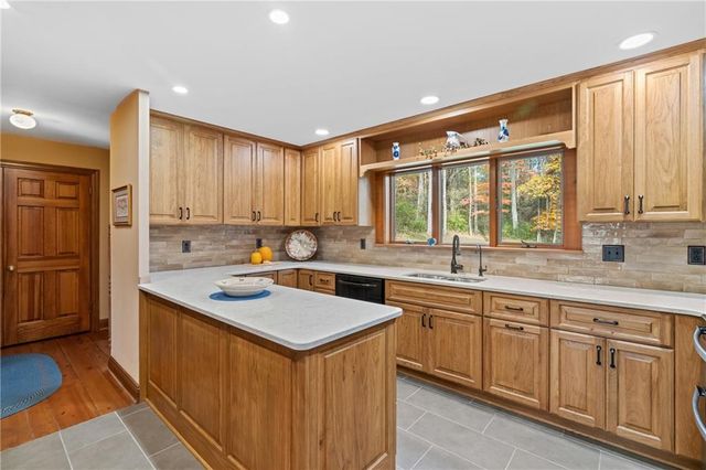 a bathroom with a granite countertop toilet sink and mirror
