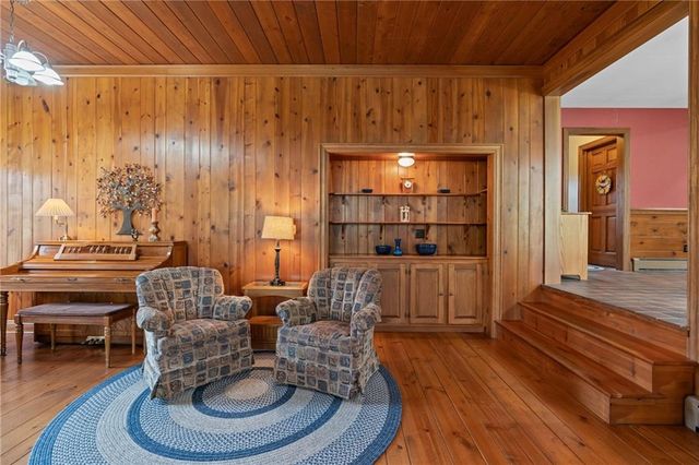 a living room with furniture or couch and a wooden floor