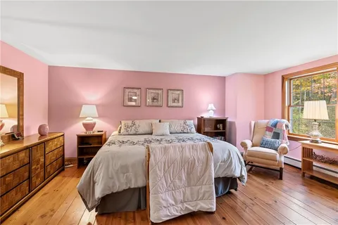 a bathroom with a granite countertop sink shower and a mirror