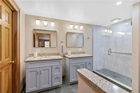 a bedroom with a bed couch and a window