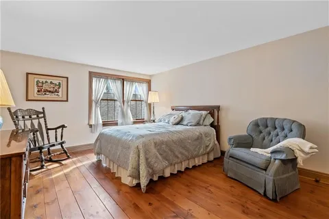 a bathroom with a toilet and a shower curtain