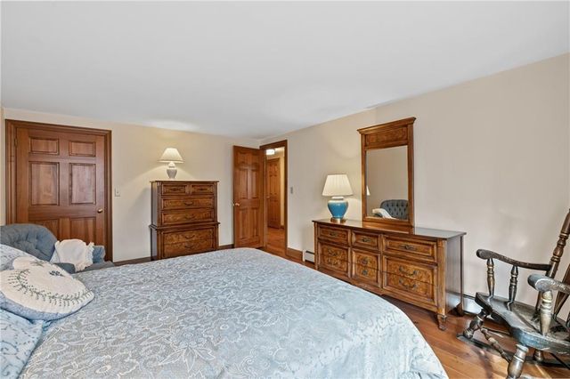 a bedroom with bed and window