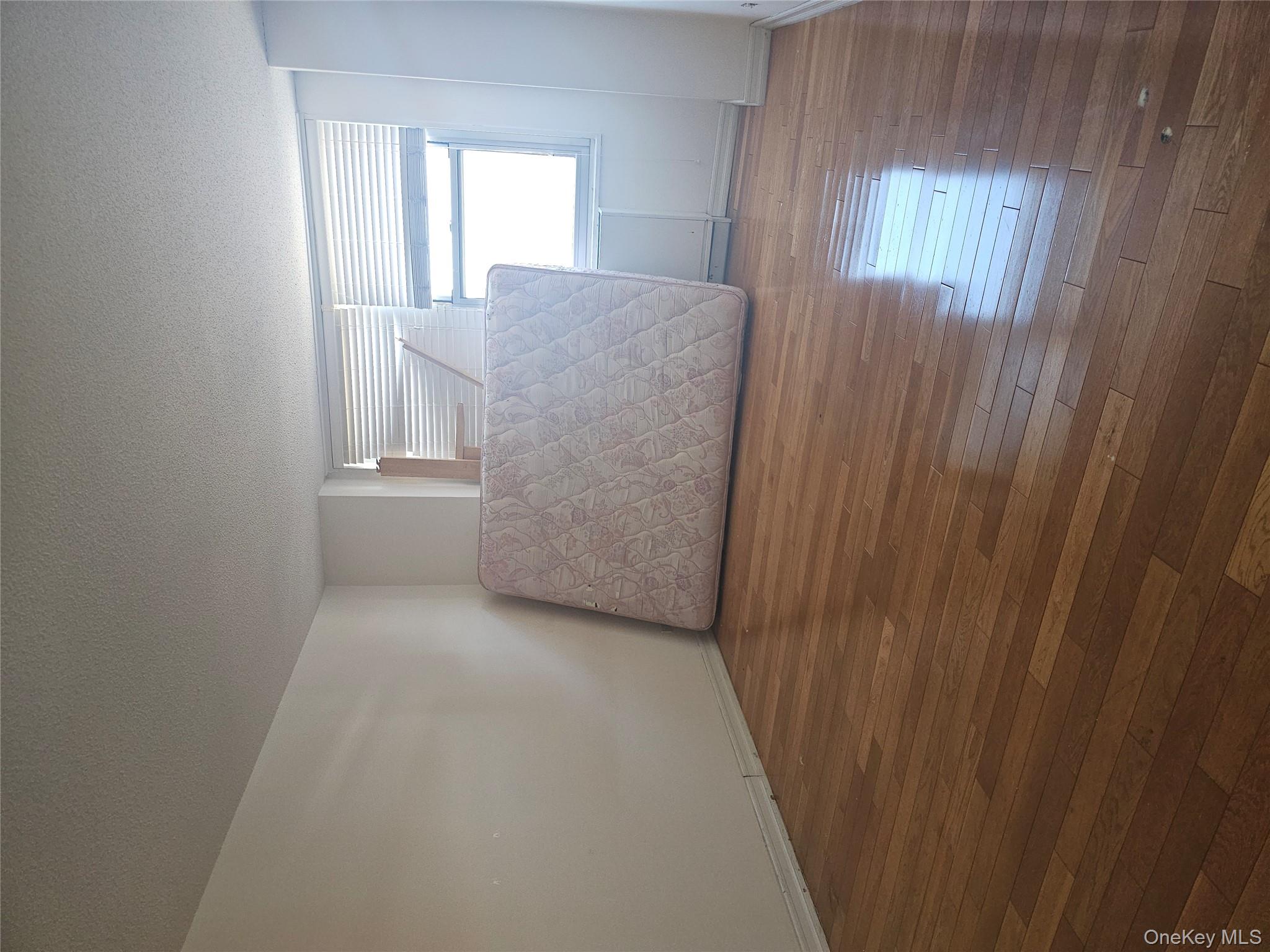 41-40 Union Street, Unit 10P Queens, NY 11355 - Photo 12 of 12 a view of room and wooden floor