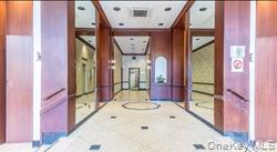 41-40 Union Street, Unit 10P Queens, NY 11355 - Photo 2 of 12 view of hall way with mirror