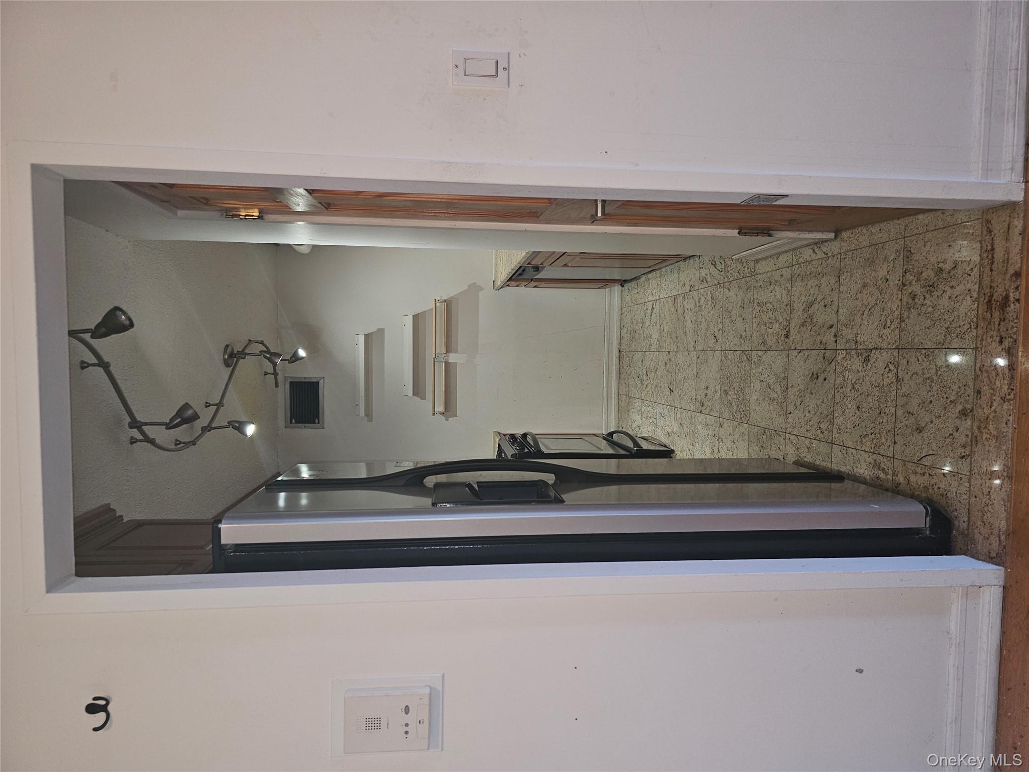 41-40 Union Street, Unit 10P Queens, NY 11355 - Photo 5 of 12 a storage room with a washer and dryer