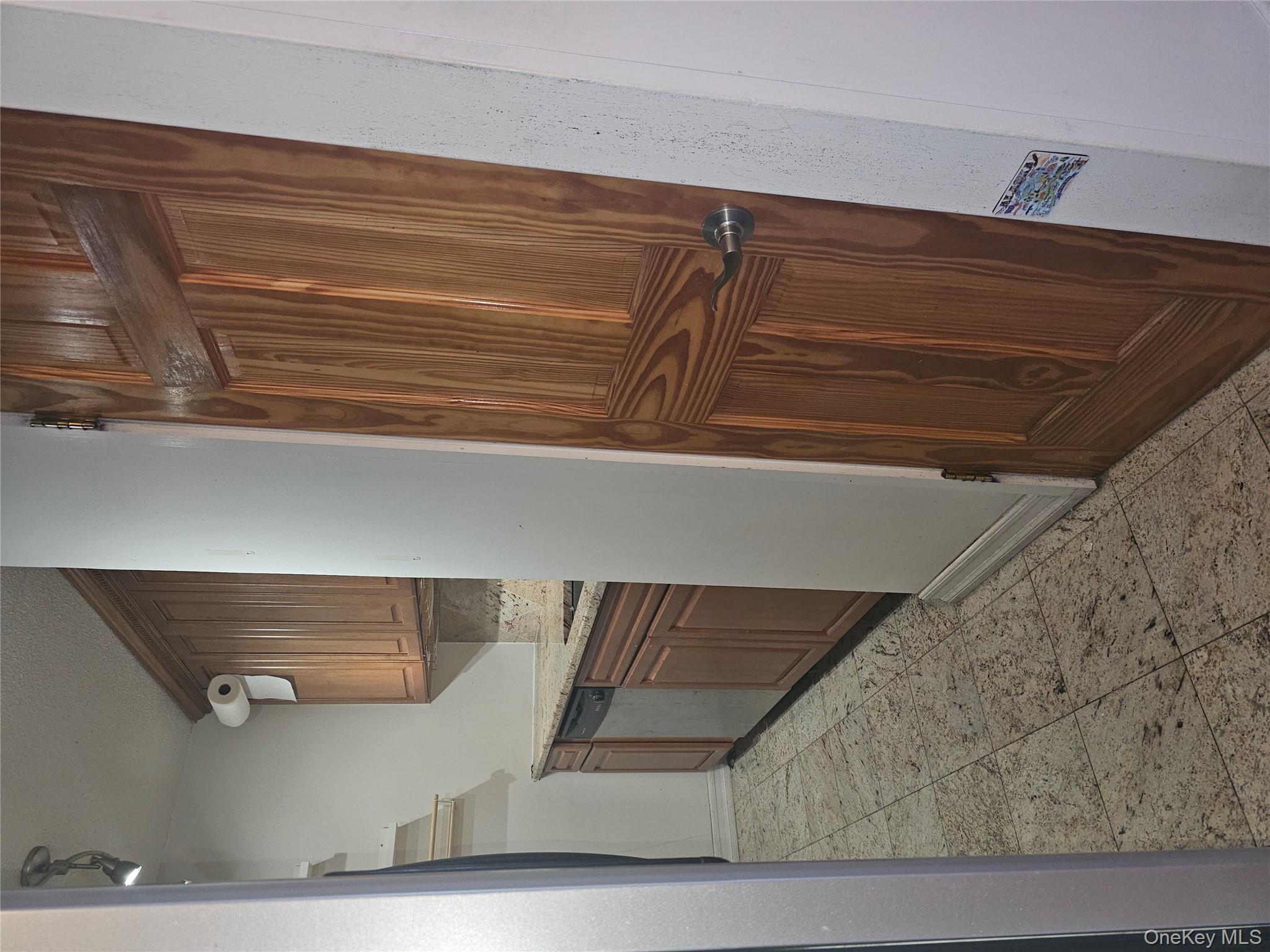 41-40 Union Street, Unit 10P Queens, NY 11355 - Photo 7 of 12 a kitchen with granite countertop a refrigerator and cabinets