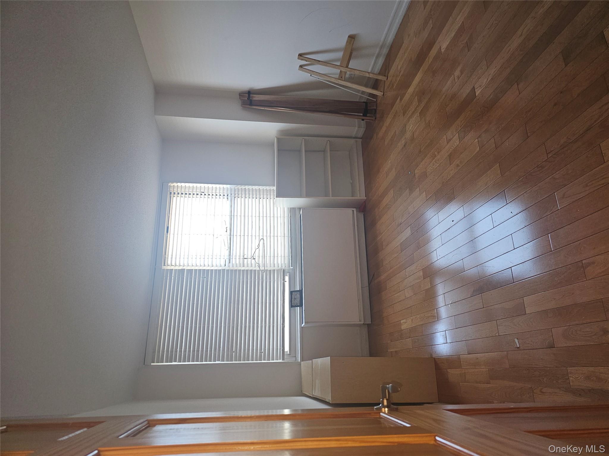 41-40 Union Street, Unit 10P Queens, NY 11355 - Photo 8 of 12 a room with furniture and a window