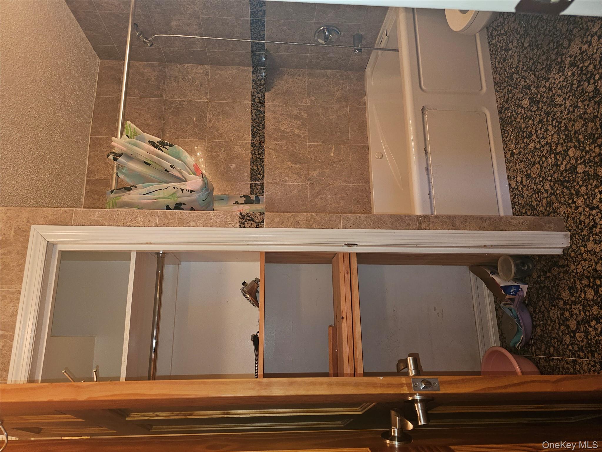 41-40 Union Street, Unit 10P Queens, NY 11355 - Photo 9 of 12 a bathroom with a toilet and a shower