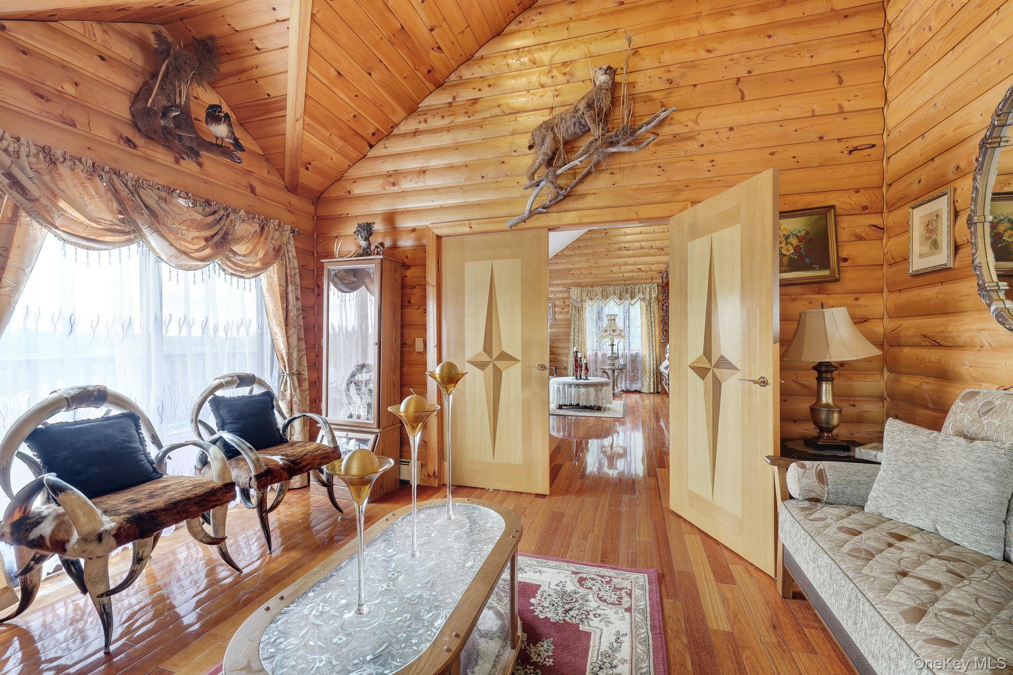 969 Hurd Road Jeffersonville, NY 12748 - Photo 11 of 33 a living room with furniture and wooden floor