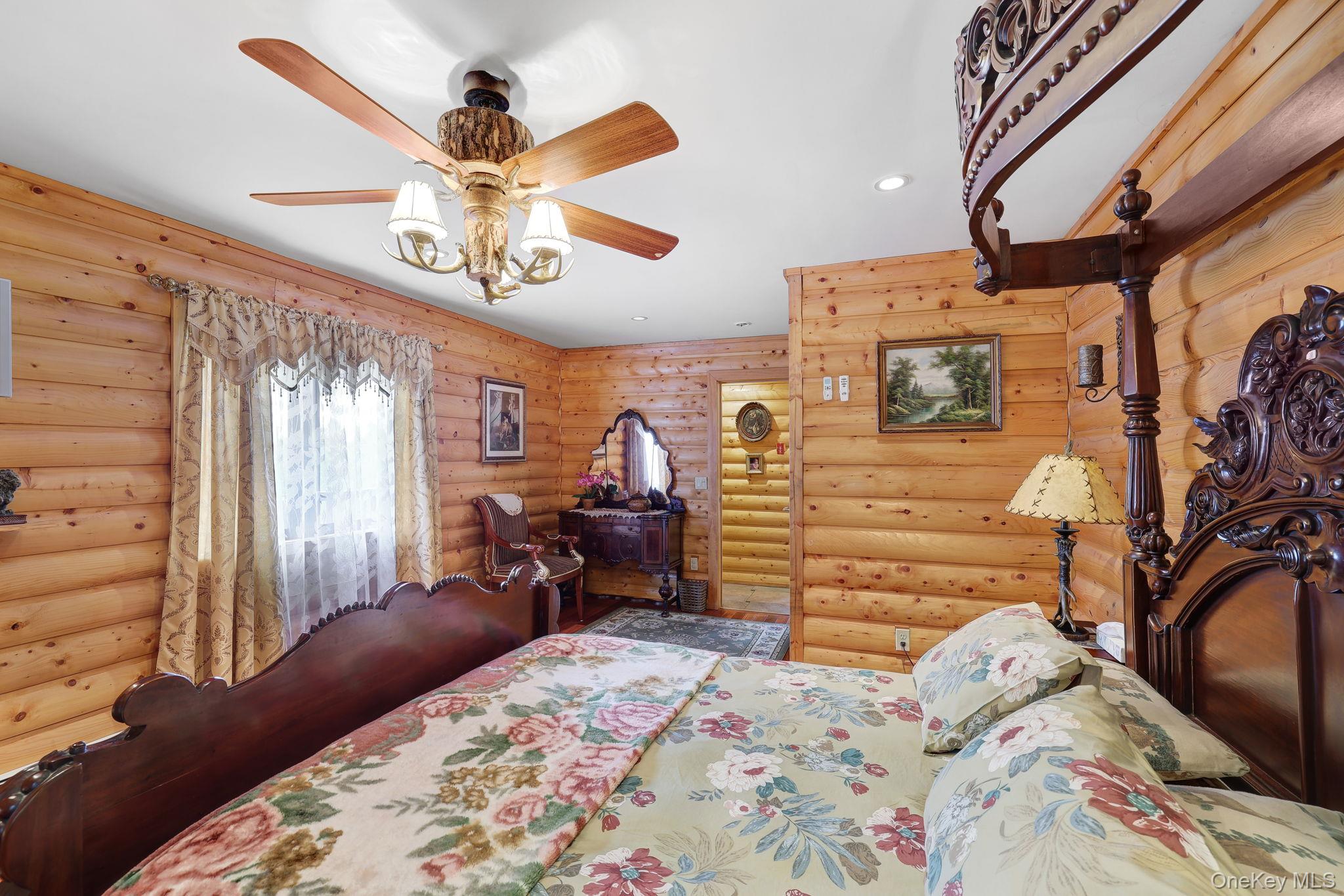 969 Hurd Road Jeffersonville, NY 12748 - Photo 13 of 33 a bedroom with a bed and wooden floor