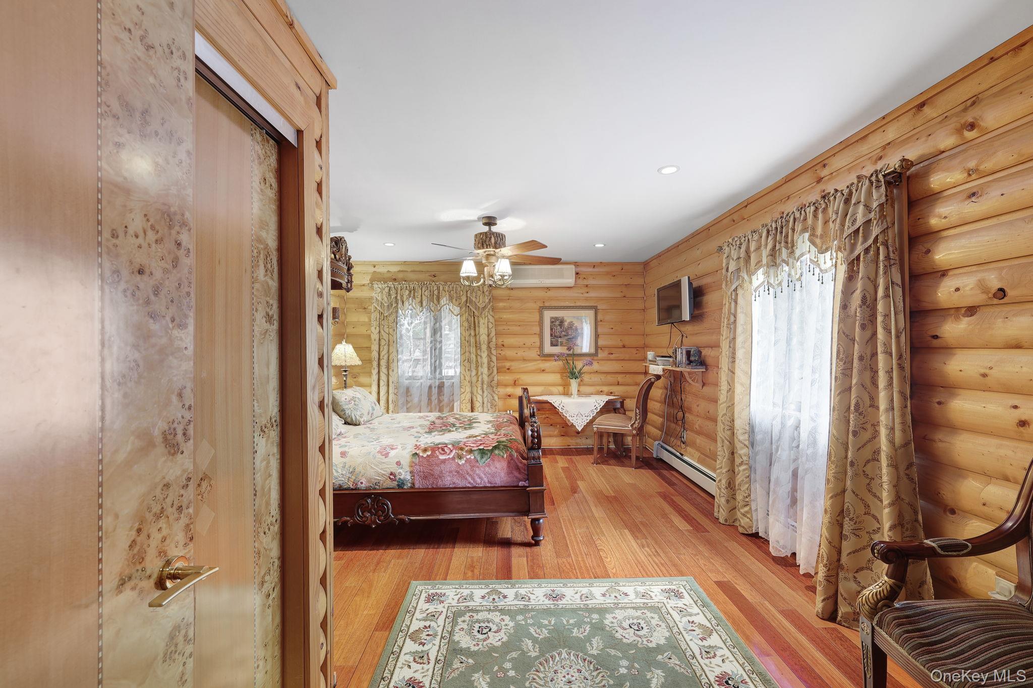 969 Hurd Road Jeffersonville, NY 12748 - Photo 14 of 33 a bedroom with furniture and a potted plant