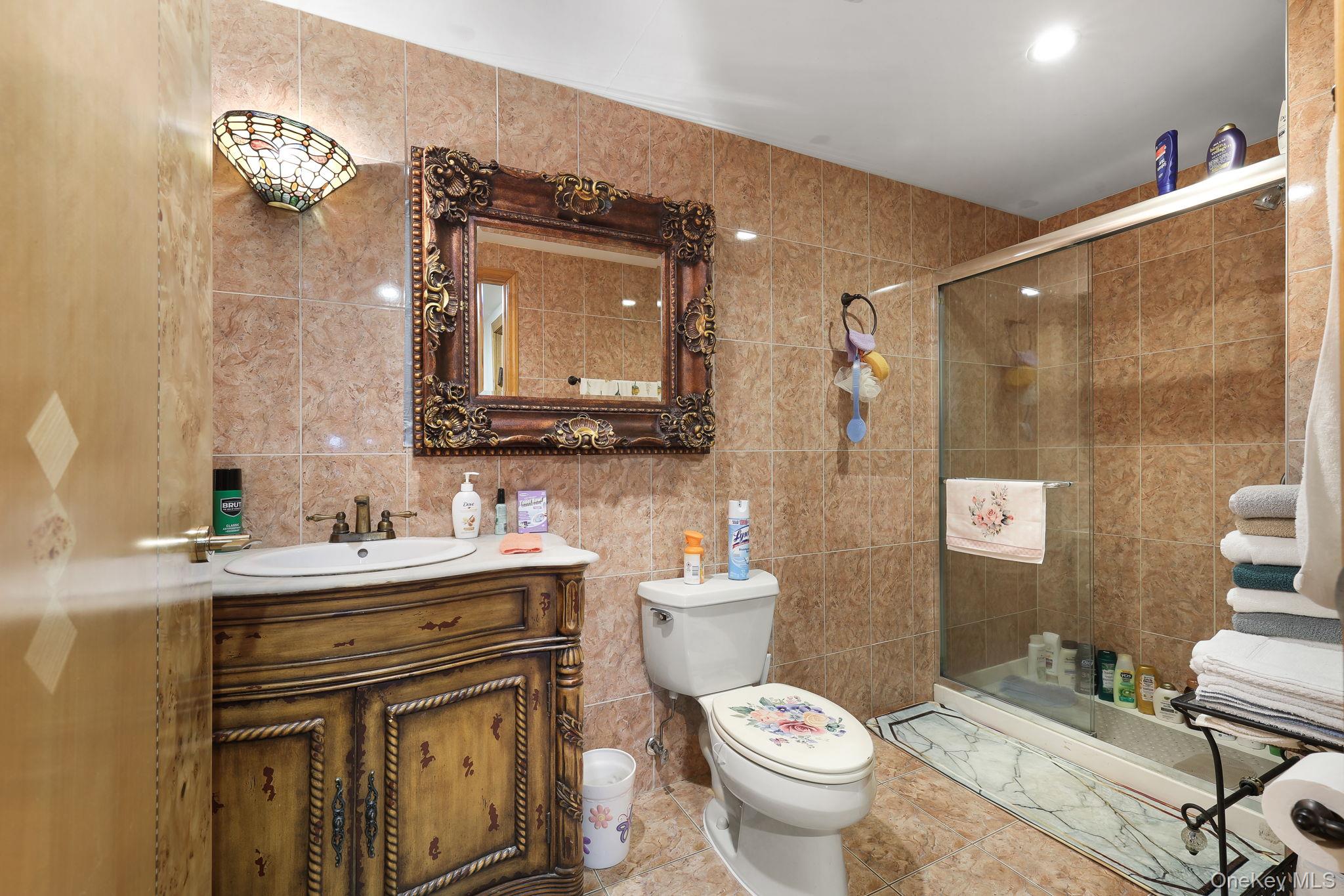 969 Hurd Road Jeffersonville, NY 12748 - Photo 21 of 33 a bathroom with a toilet a sink and mirror