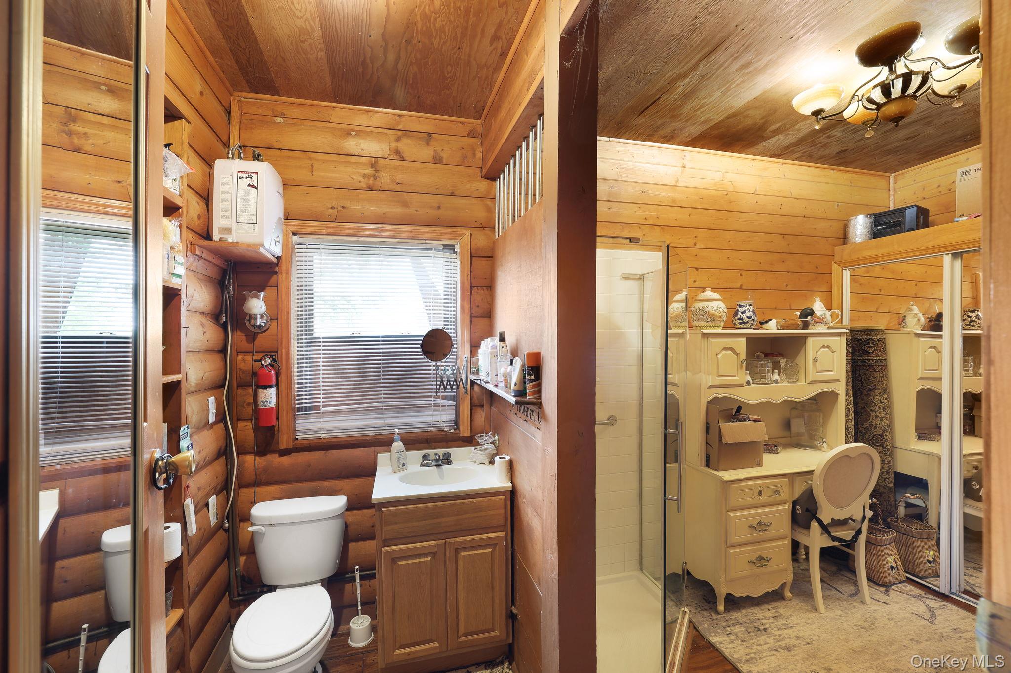 969 Hurd Road Jeffersonville, NY 12748 - Photo 28 of 33 a bathroom with a toilet a sink and a shower