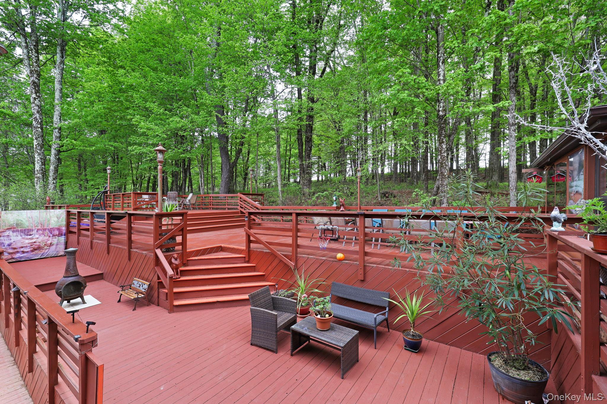 969 Hurd Road Jeffersonville, NY 12748 - Photo 30 of 33 a view of a chairs and table in patio
