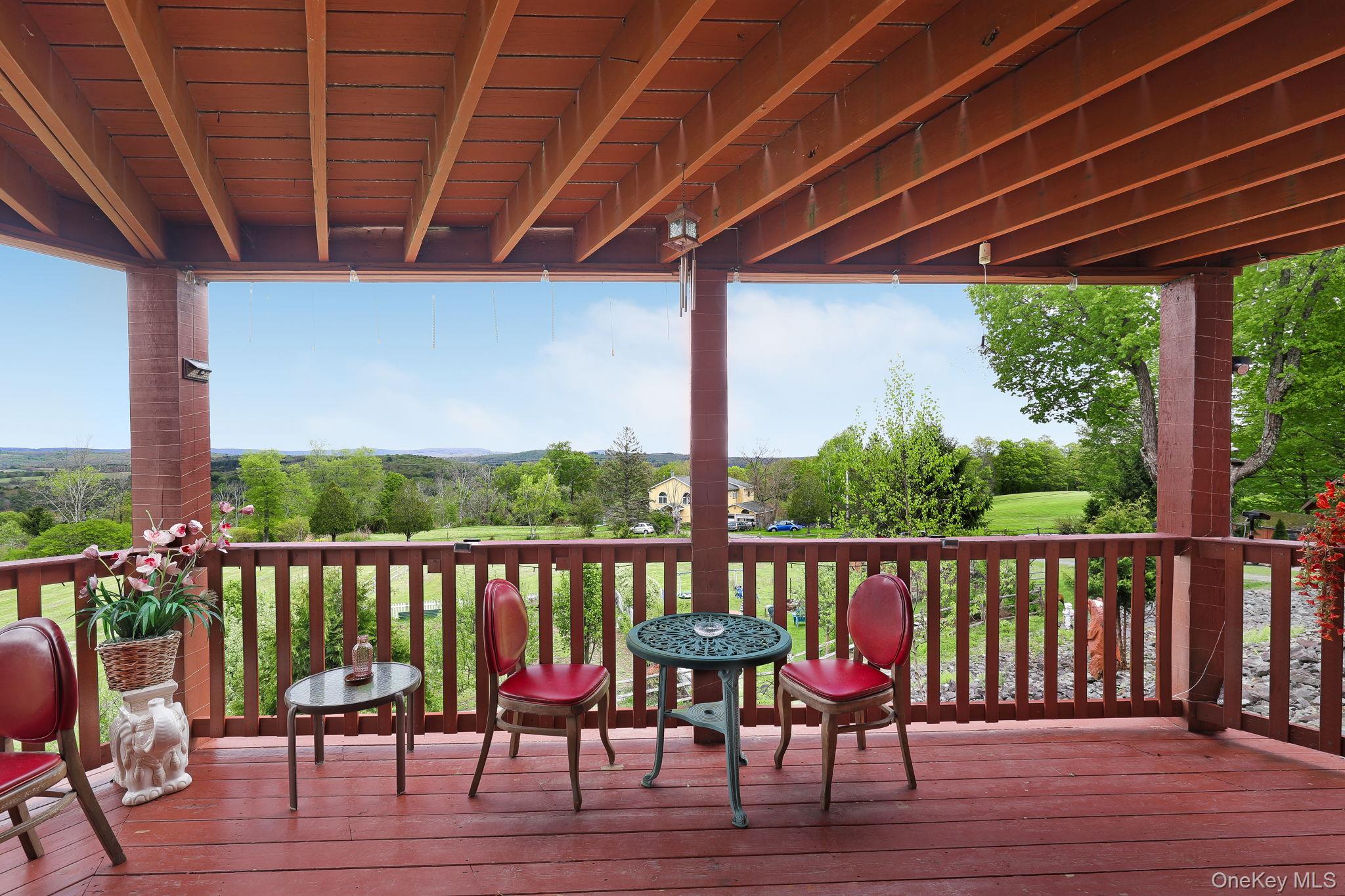 969 Hurd Road Jeffersonville, NY 12748 - Photo 3 of 33 a view of a chairs on the deck