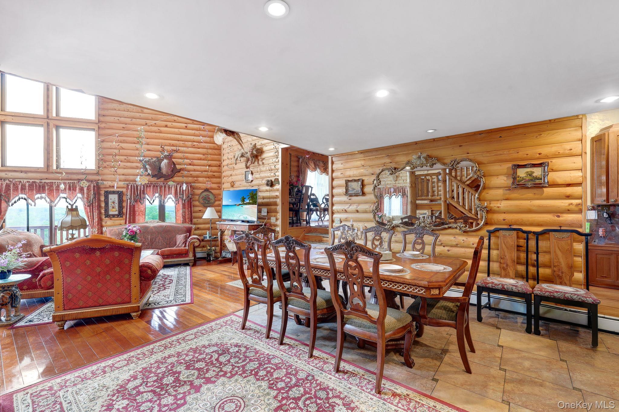 969 Hurd Road Jeffersonville, NY 12748 - Photo 6 of 33 a dining room with furniture and wooden floor