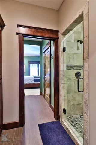 a view of a bathroom with a glass door