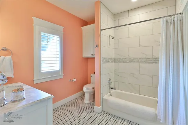 a bathroom with a bathtub a sink and a shower