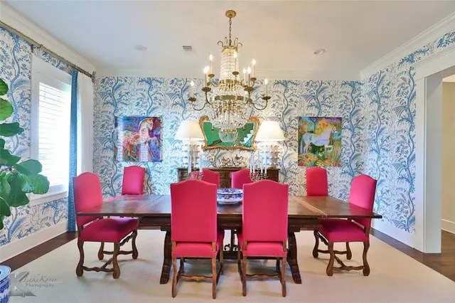 a view of a dining room with furniture and chandelier