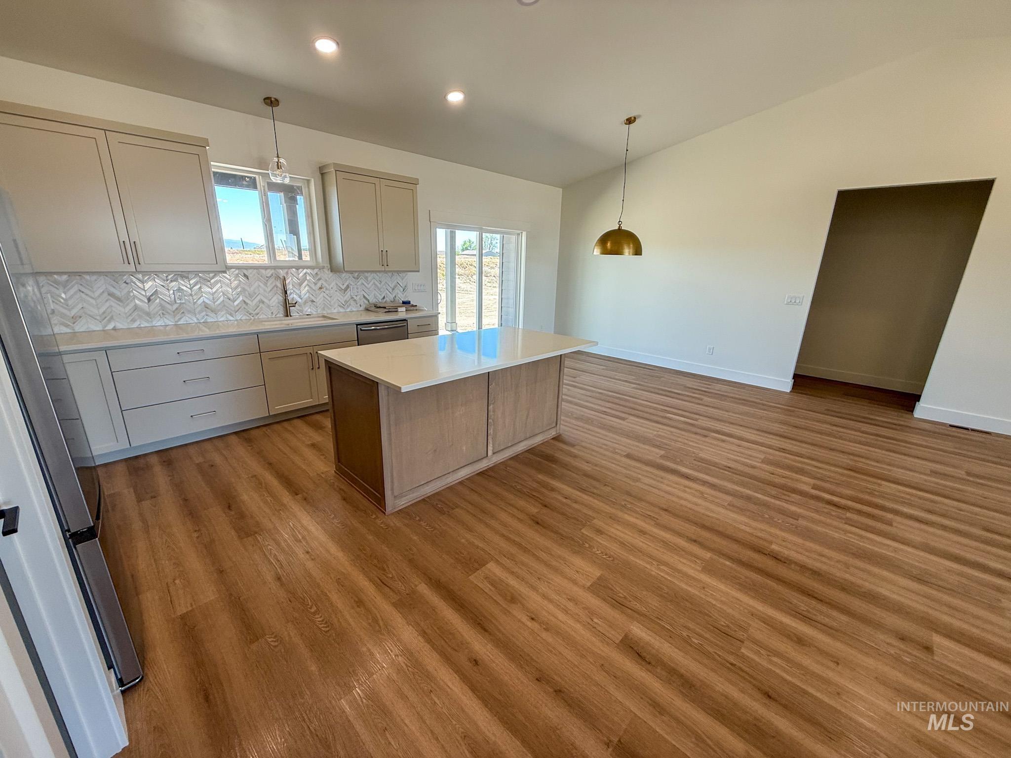 1419 Cardon Court Rupert, ID 83350 - Photo 4 of 15 Open-concept kitchen and living area featuring wood-finish flooring