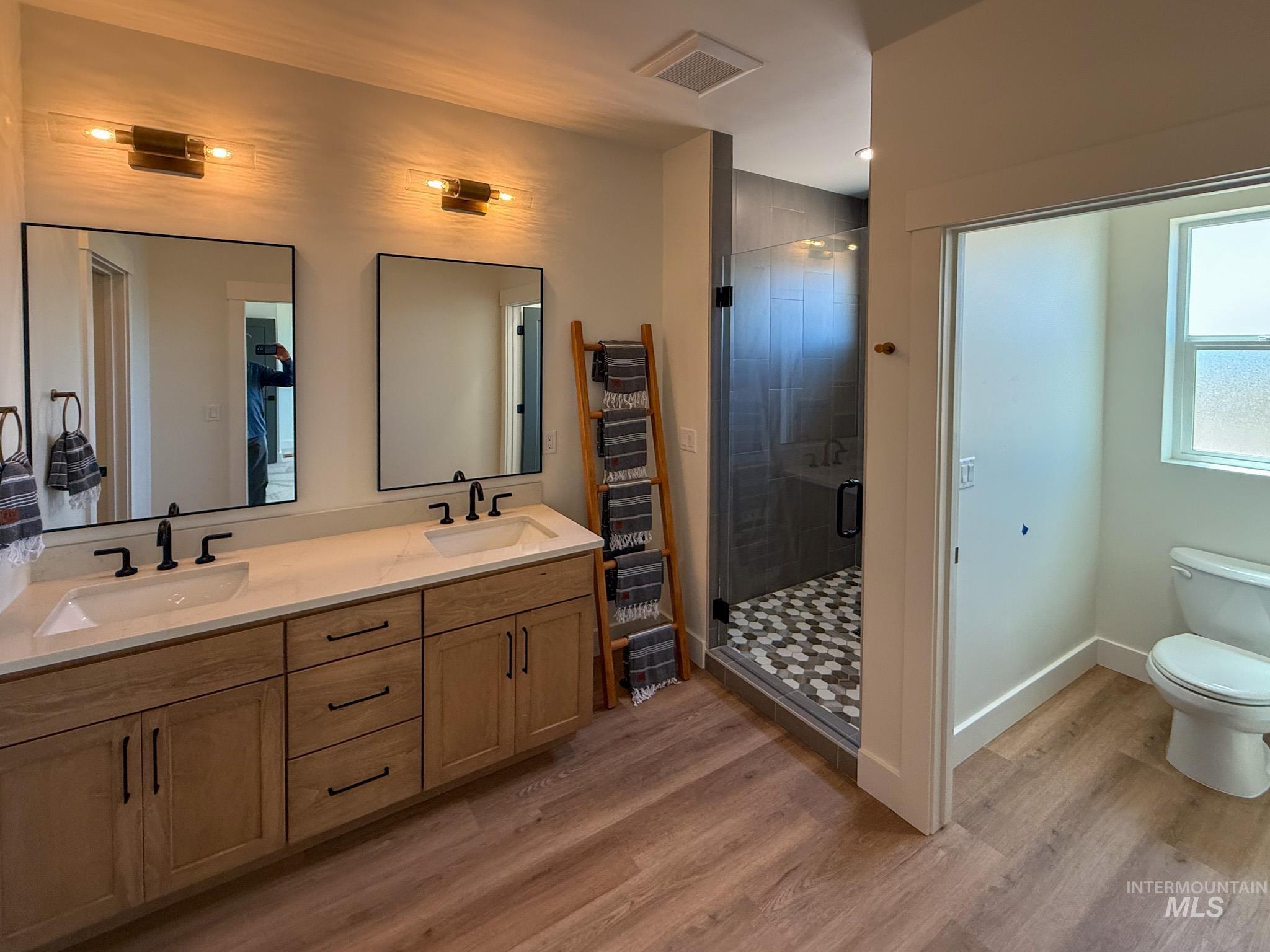 1419 Cardon Court Rupert, ID 83350 - Photo 8 of 15 Modern bathroom featuring a dual vanity with light wood-finish cabinetry and quartz countertops