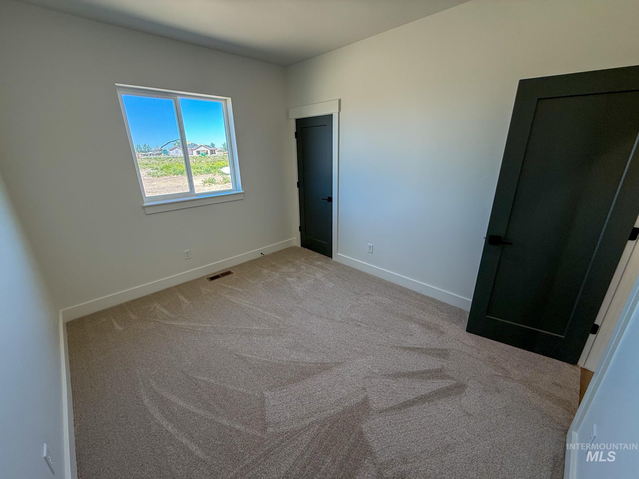 1419 Cardon Court Rupert, ID 83350 - Photo 9 of 15 Neutral-toned carpet flooring complements light wall finishes